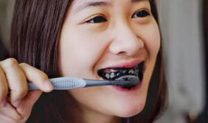 Brushing with Activated Charcoal Powder